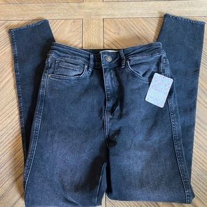 Free People black frayed hem jeans.